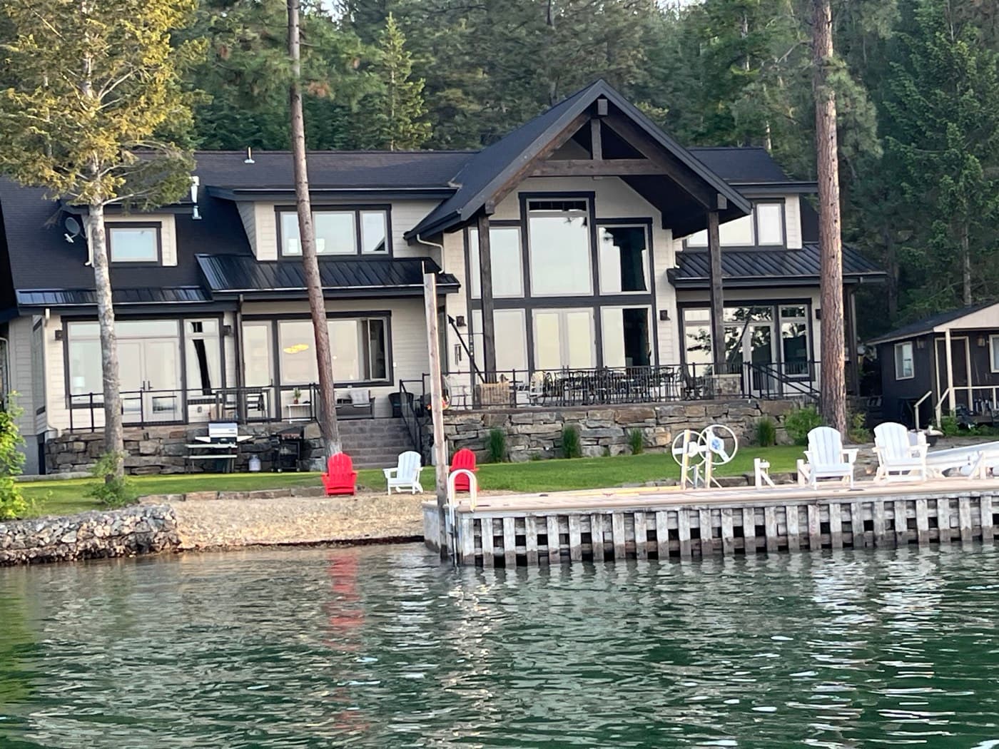 Modern lakefront home with dock on Flathead Lake